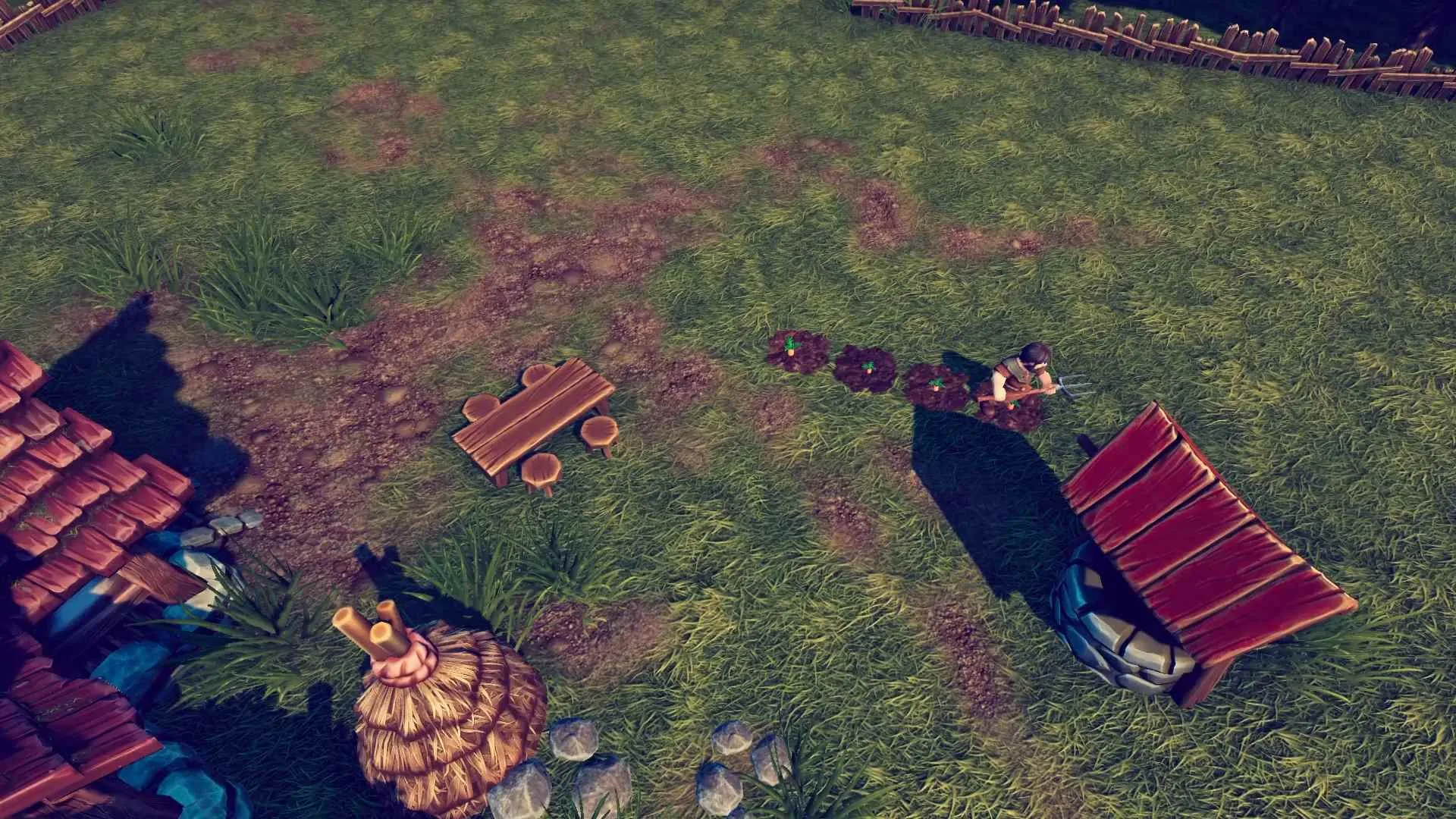 Screenshot from SimGarden showing a character tending to crops beside a well, with a picnic table and a cottage roof visible in a grassy yard 